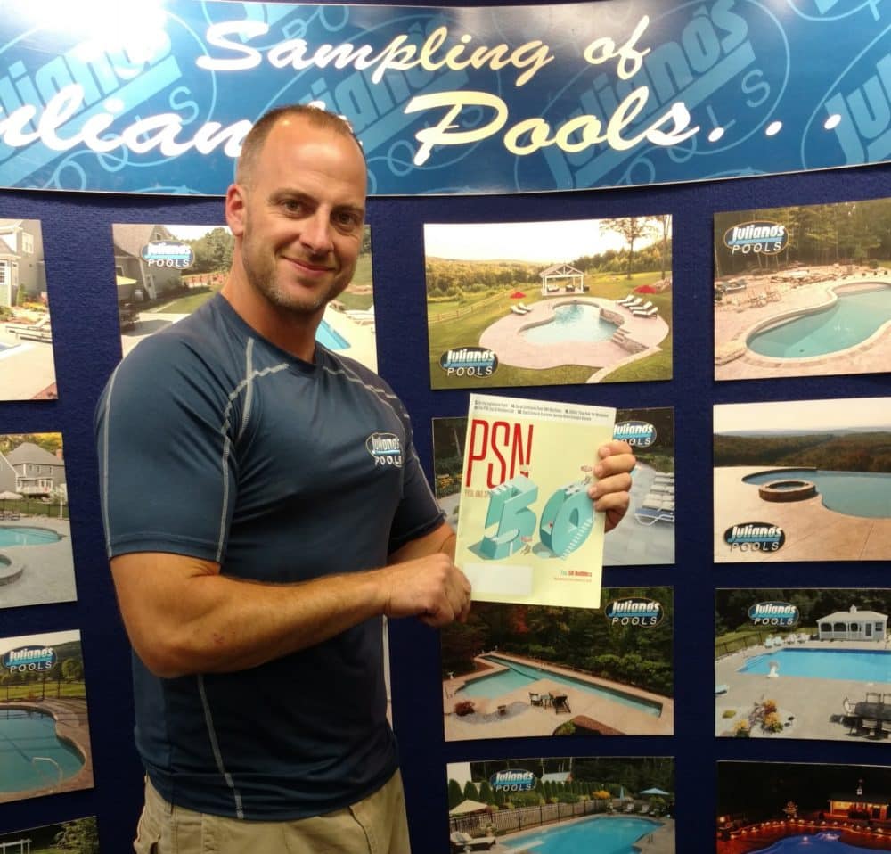 This is a photo of brian juliano with the top 50 pool builders award.