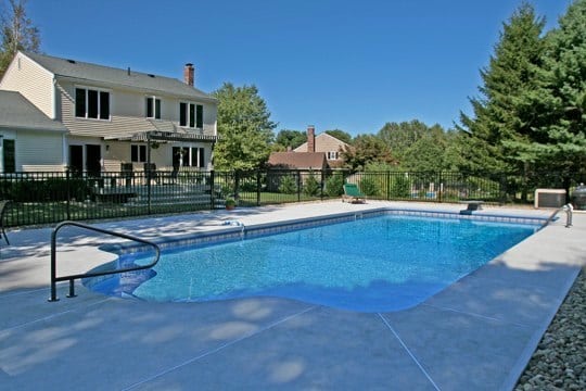This Is A Photo Of A Patrician In Ground Pool In Simsbury, CT With Table, Chairs And Umbrella
