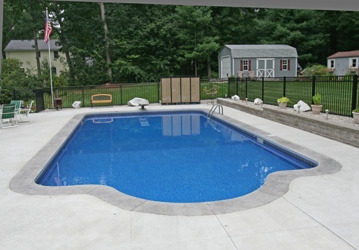 This Is A Photo Of A Patrician In Ground Pool In East Longmeadow, MA Diving Board And Fence In Backyard.