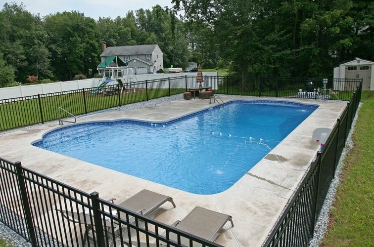 This Is A Picture Of A Custom True L Roman Inground Pool With Black Fence Installed By Julianos