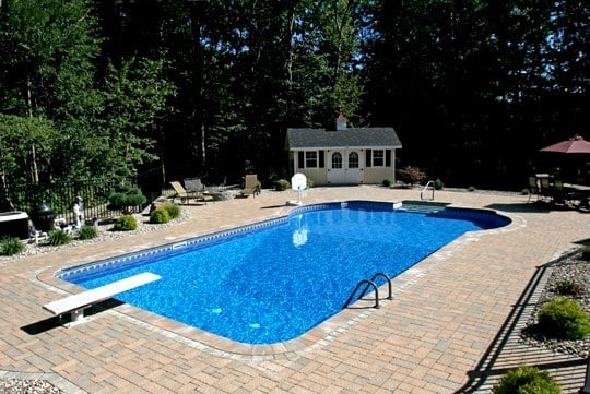Custom Pool Installed By Juliano's With Diving Board, Gate, And Small House Built Poolside