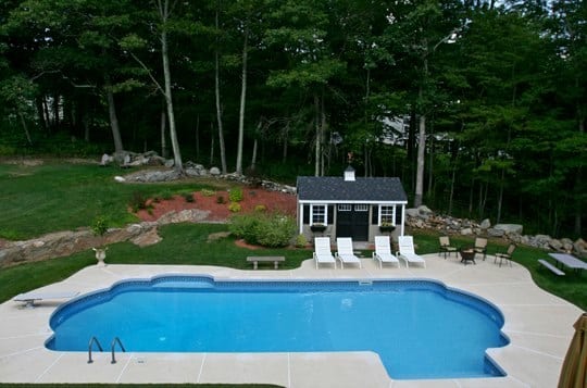 This Is A Photo Of A Roman In Ground Pool In Tolland, CT With Custom Pavers, And Steps.