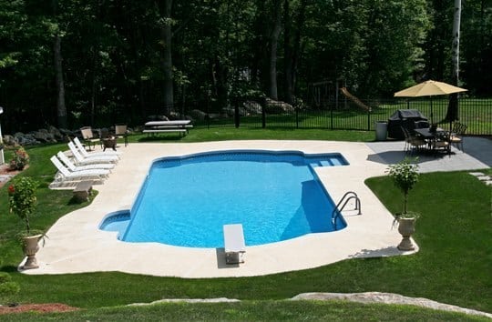 This Is A Photo Of A Roman In Ground Pool In Tolland, CT With Custom Pavers, And Steps.
