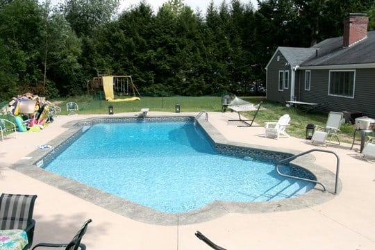This Is A Photo Of A Lazy L Style Custom Inground Swimming Pool With Steps.