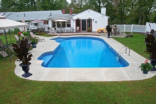 This is a photo of a keyhole style inground swimming pool.
