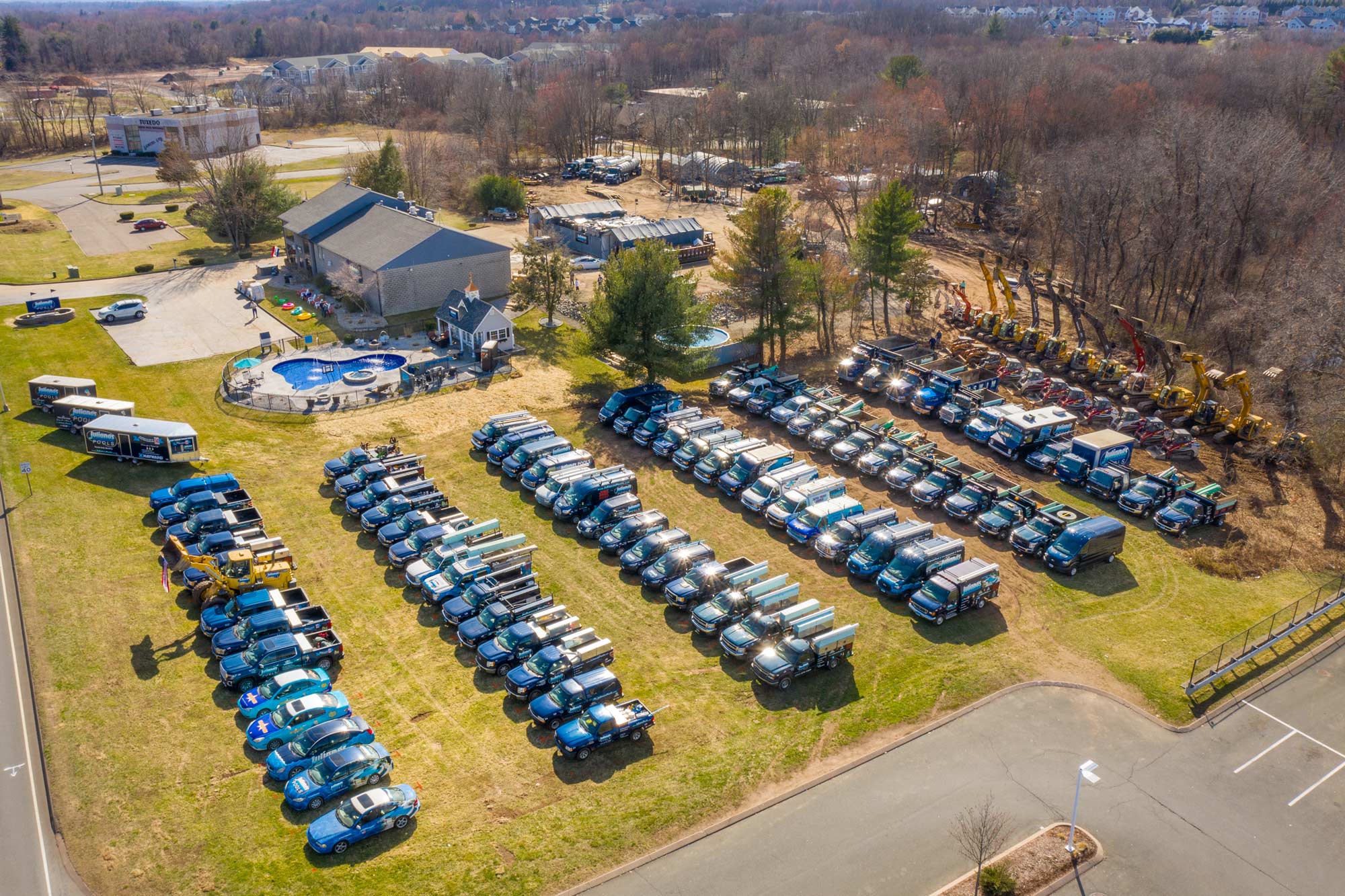 This is an aerial photo of Juliano's trucks and in ground swimming pool construction equipment.
