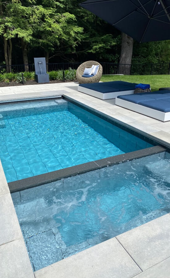 9x21 Cape plunge pool with hot tub and stone patio